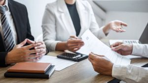 Recruiter holding reading a resume with talking during about his profile of candidate _ Premium Photo